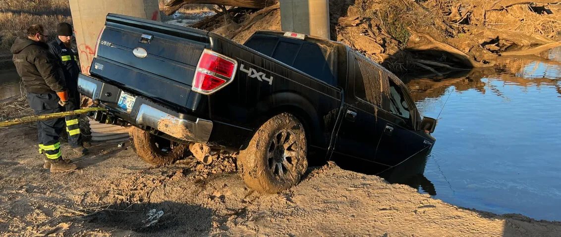 Brown & Sons recovering a truck from water near Shawnee, Oklahoma